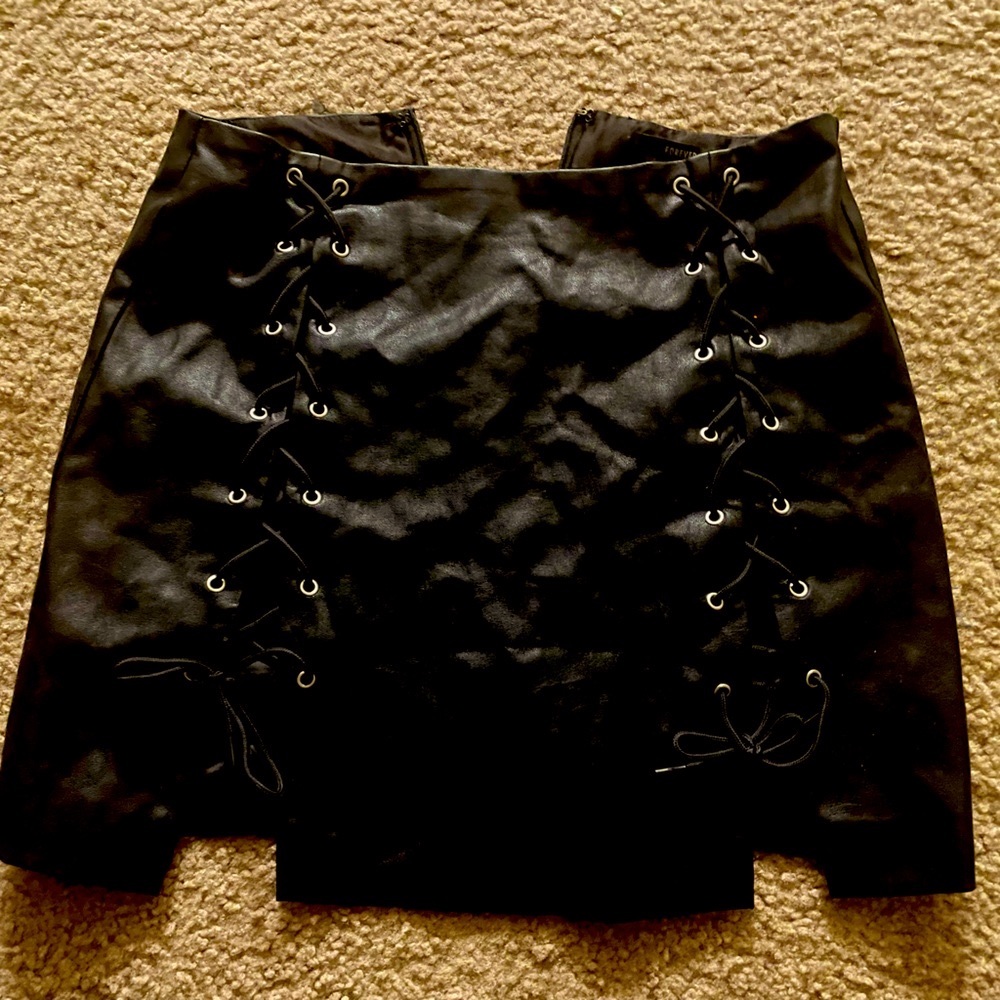 Mini laced black faux leather skirt